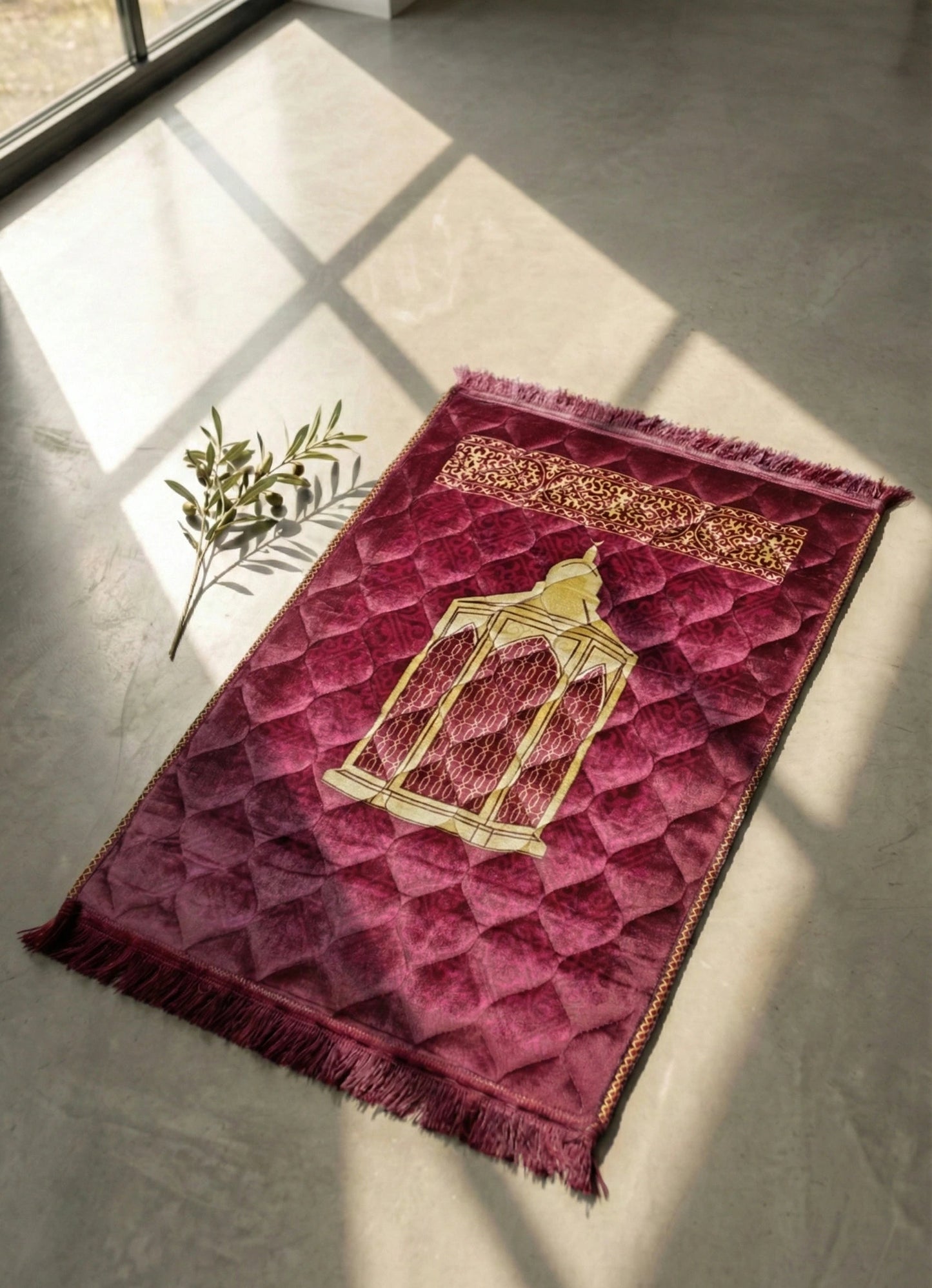 Red Jay Namaz with gold design on a gray floor