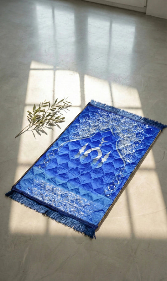 Blue textured soft velvet jay namaz and prayer mat with geometric pattern on a light floor