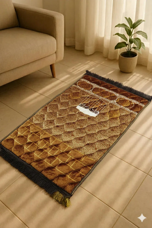 Brown Islamic prayer mat with intricate geometric patterns beside beige sofa and potted plant on tiled floor